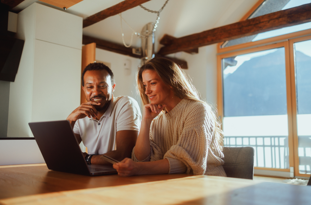 couple sitting in front of computer